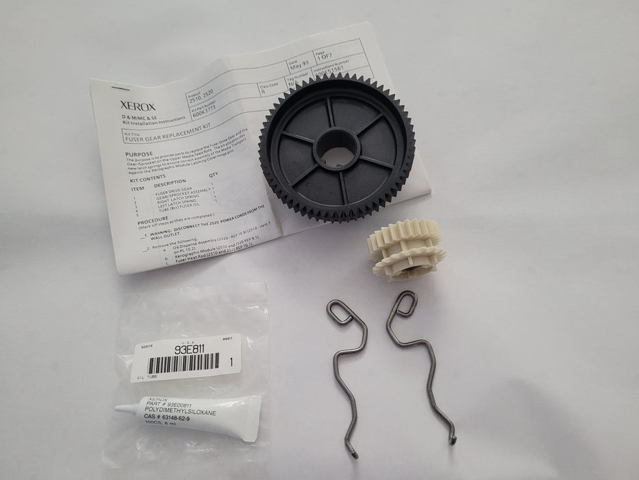 Xerox replacement gear kit including a black plastic sprocket, a beige plastic gear, two metal wire clips, a tube of white adhesive, and an instruction sheet on a white background.